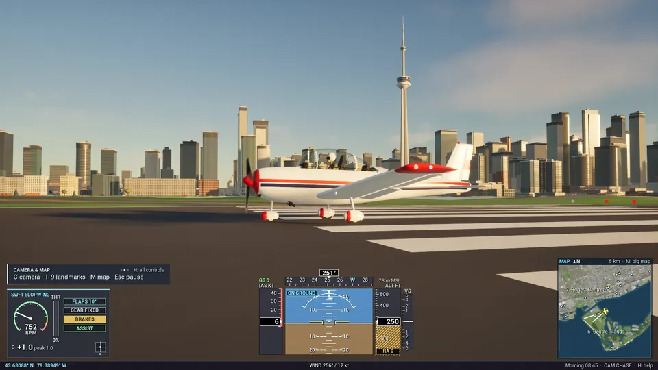 The SW-1 Slopwing on the runway at Billy Bishop, side on, with the CN Tower behind.